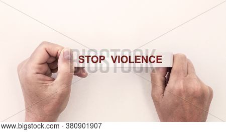 Stop Violence Sign Inscription Text On White Tape In Hand