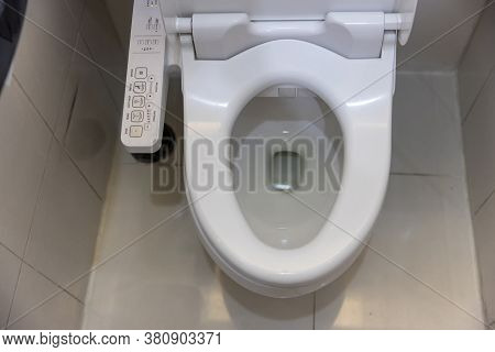 Electronic Control Panel Of Toilet Sanitary Ware With Automatic Flush System. Toilet With Electronic