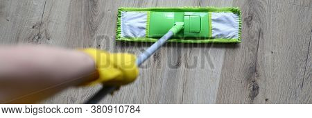 Top View Of Person Hands In Hands Holding Mop And Cleaning Floor. Tools For Cleaning. Microfiber Flu