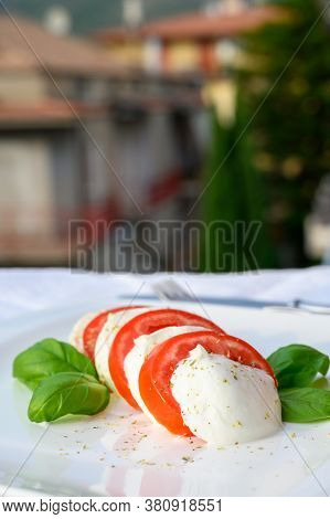 Fresh Caprese Salad Made With Soft White Italian Cheese Mozzarella Buffalo, Green Basil, Red Tomatoe