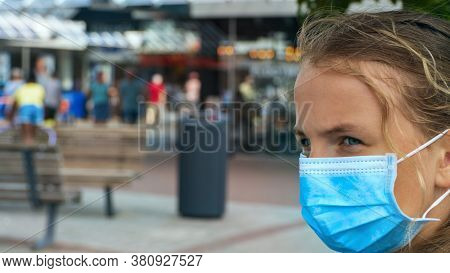 A Young Girl Wears A Face Mask On The Streets Of The City.cute Teenage Girl With A Surgical Mask On 