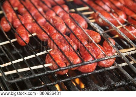 Sausages With Ground Beef Are Cooked On Coals. High Quality Photo