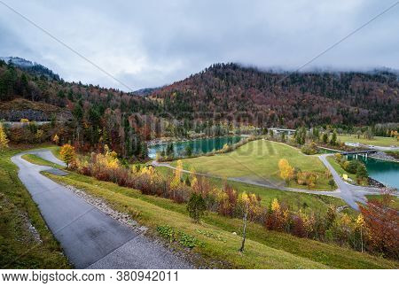 Alpine Isar River And Isarbrucke Bridge View From Sylvenstein Stausee Damm , Bavaria, Germany. Autum