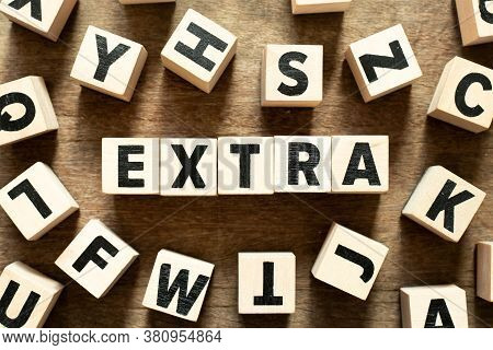 Letter Block In Word Extra With Another Block On Wood Background