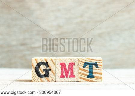 Alphabet Letter In Word Gmt (abbreviation Of Greenwich Mean Time) On Wood Background