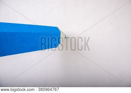 Blue Pencil Stands On A White Background