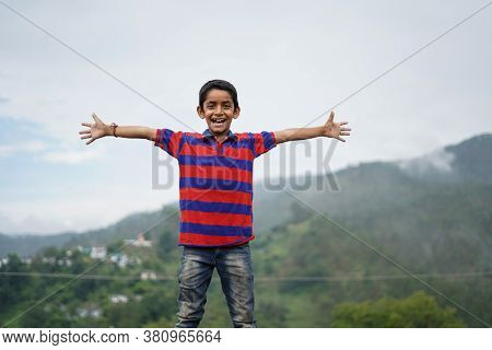 Portrait Of A Indian Pahadi Kid Who Belongs To The Mountains. Freedom And Joy.