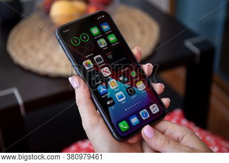 Alanya, Turkey - July 10, 2020: Woman Hand Holding Iphone 11 With Phone Widgets Home Screen Ios 14 O