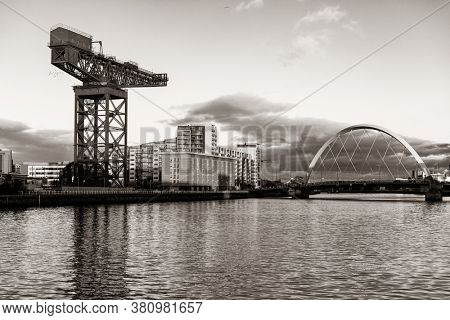 GLASGOW, UK - FEB 26, 2020: The Finnieston Crane or Stobcross Crane stand at waterfront of city center in Scotland, United Kingdom as the symbol of engineering heritage