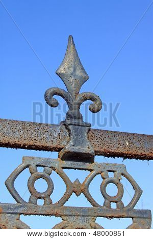 Rusty Wrought Iron In The Blue Sky