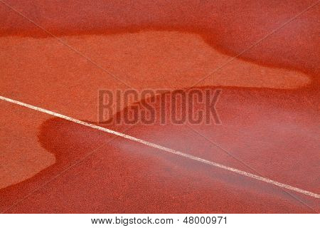 Traces Of Water On Red Plastic Runway