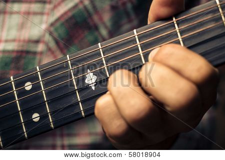 Close Up On Hand Playing Guitar