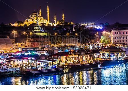 Night View On The Restaurants At The End Of The Galata Bridge, Sultanahmet, At Sunset With The Famou