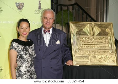 Lucy Liu and Manolo Blahnik  at the Rodeo Drive Walk of Style Award Gala. Rodeo Drive, Beverly Hills, CA. 09-25-08
