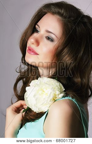 Femininity. Sincere Brunette With White Peony