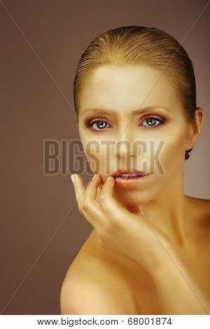 Pure Beauty. Gilded Woman's Face