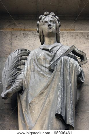 PARIS, FRANCE - NOV 09, 2012: Saint Cecilia, architectural details of Eglise de la Madeleine. Madeleine Church was designed in its present form as a temple to the glory of Napoleon's army.