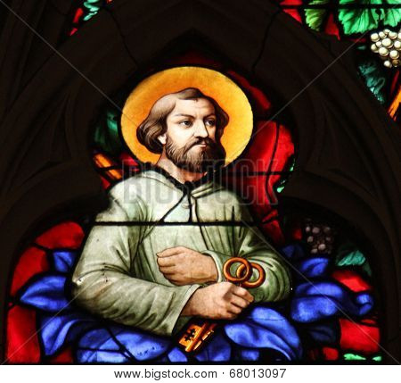 PARIS, FRANCE - NOV 11, 2012: Apostle Saint Peter, stained glass from Church of St-Germain-l'Auxerr ois founded in the 7th century, was rebuilt many times over several centuries. 