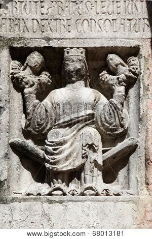 PARMA,ITALY-MAY 01, 2014:Faith(holding Justice and Peace)relief at the baptistery from Benedetto Antelami.Baptistery in Parma is considered to be among the most important Medieval monuments in Europe.