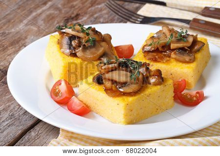 Polenta With Mushrooms, Tomatoes And Thyme On The Table