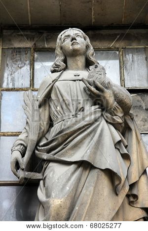 PARIS, FRANCE - NOV 09, 2012: Saint Agnes of Rome, architectural details of Eglise de la Madeleine. Madeleine Church was designed in its present form as a temple to the glory of Napoleon's army.