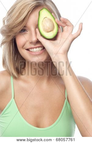 portrait of attractive  caucasian smiling woman isolated on white studio shot eating avocado