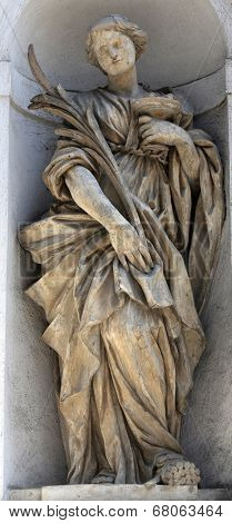PARMA, ITALY - MAY 01, 2014: Saint Lucia statue, St Lucia church. Church, originally known as St. Michael in the Channel is mentioned in documents in 1223, built in 1615 and dedicated to St. Lucia