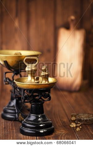 Vintage cast iron kitchen  scale with weights on old wooden table