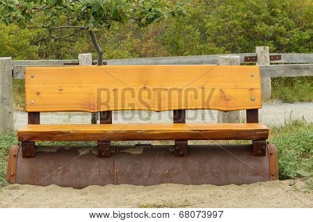 Cedar Wooden Park Bench On The Beach