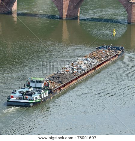 Barge transports waste on the river