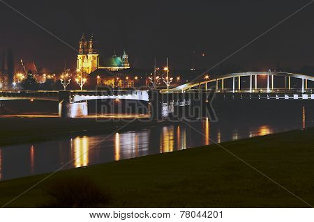 River Warta, bridge and cathedral at night