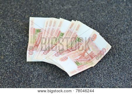 Russian Money On Grey Asphalt. 5000 Rubles Banknotes Closeup