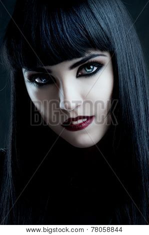 Gorgeous Brunette With Dark Makeup And White Skin