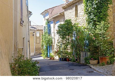 Houses And Flowers In An Old Village In South Europe