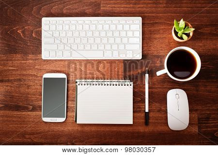 Neat Workstation On A Wooden Desk