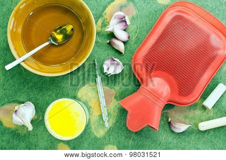 home made remedy for flu: glass of hot milk with honey butter and garlic
