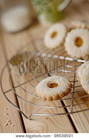 Linz Biscuit With Peach Marmalade With A Glass Of Milk In The Background