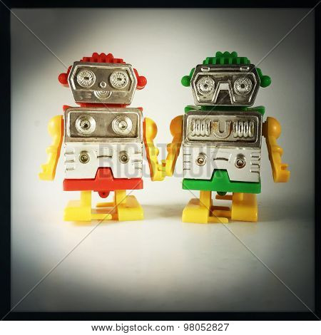 Vintage style of Robot couple holding hands with an Instagram style filter