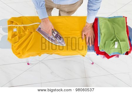 Man Ironing Yellow T-shirt