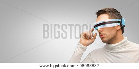 people, technology, future and progress - man with futuristic 3d glasses over gray background