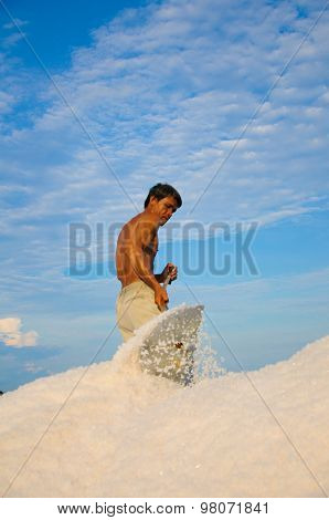 Salk workers work in salt field in Vietnam