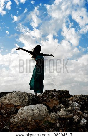 Silhouette Of Young Attractive Woman With Opened Arms Outdoors I