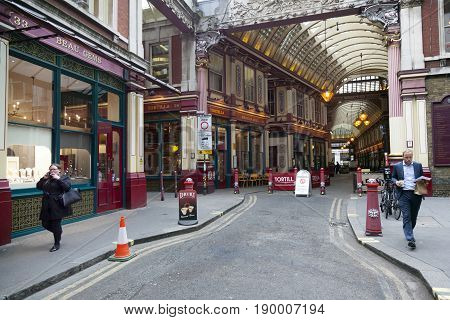London United Kingdom 7 may 2017: people leave leadenhall market for city of london with cigarette and coffee