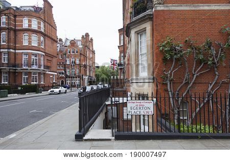 London United Kingdom 7 may 2017: fig tree against red brick wall on egerton place in london kensington