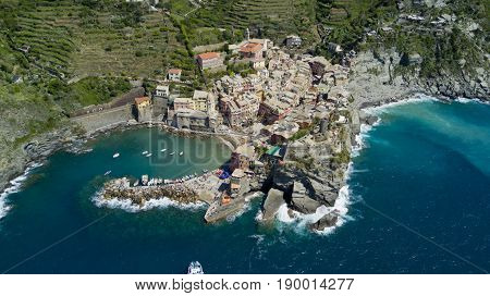 Aerial footage with drone on Vernazza, one of the famous Cinqueterre country, small village with colored houses on the cliff over the sea