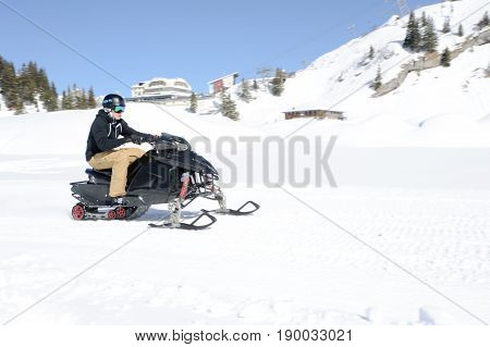 Men On Snowmobile At Engelberg On The Swiss Alps