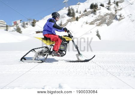 Men On Snowmobile At Engelberg On The Swiss Alps