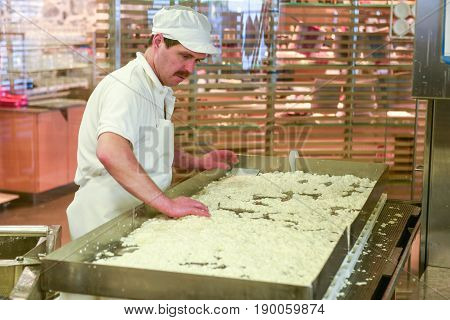 Cheesemaker Preparing The Cheese In A Show Dairy At Engelberg