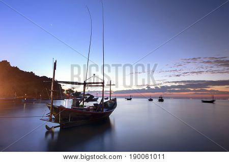 Silhouette Fisherman boat at sunset . Fishermen fishing boat  in beach side Thailand.
