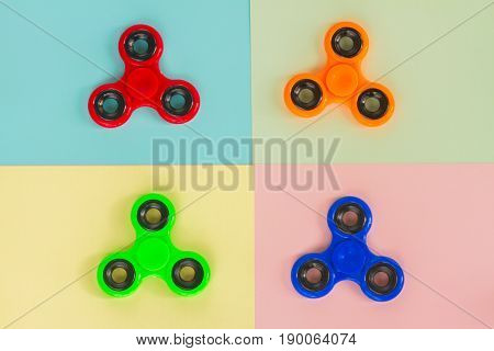 trendy fidget spinners - styled pop art flat lay scene with set of generic design spinners